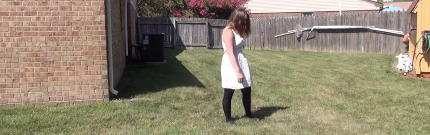 Screenshot of "Scary Movie Review Getting Closer" A woman is walking through a yard like a zombie